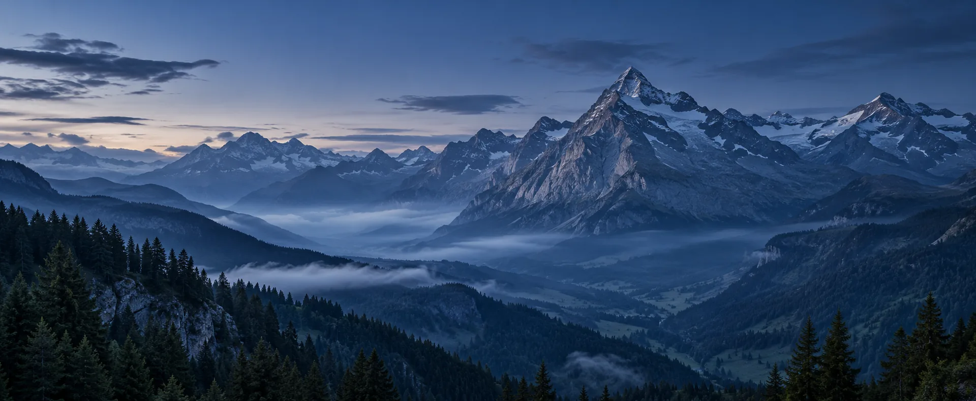 Alpine peaks above a misty valley